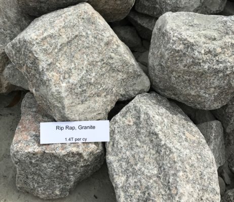 close-up of gray rip rap granite stone blocks at stone garden