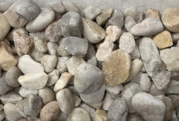 close-up of small white river rock at stone garden