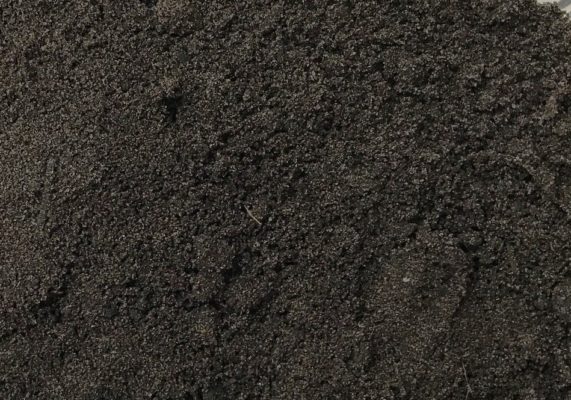 close-up of brown topsoil at stone garden