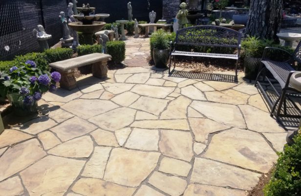 flagstone patio and pathway, stone bench, garden art, fountain, and statuary at stone garden's inspiration garden display