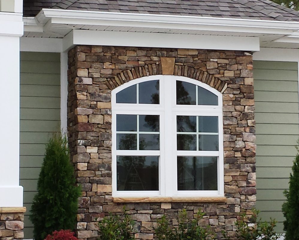 cultured stone veneer facade on the exterior wall of a home