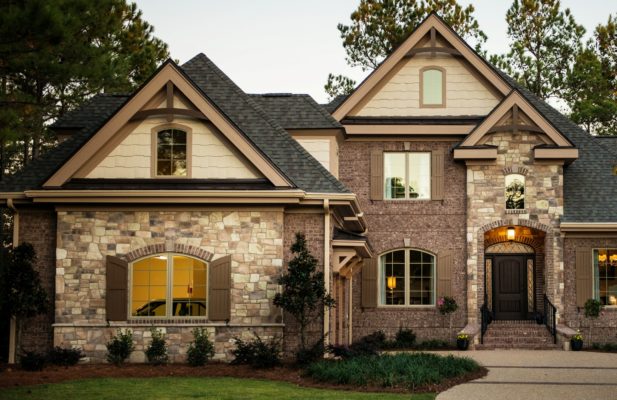 stone veneer facade on exterior walls of a home and garage