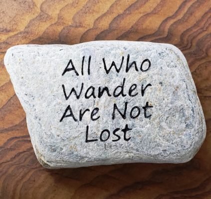 engraving on stone rock gift for the garden saying All Who Wander Are Not Lost
