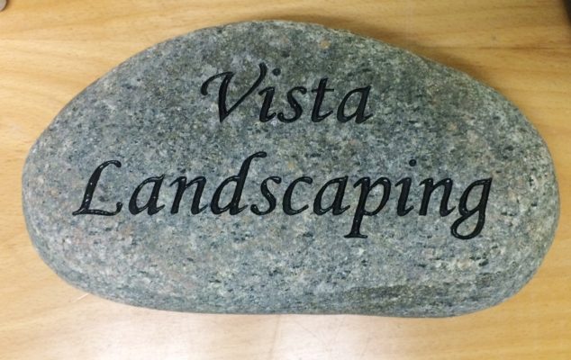 engraving on stone rock business sign for Vista Landscaping